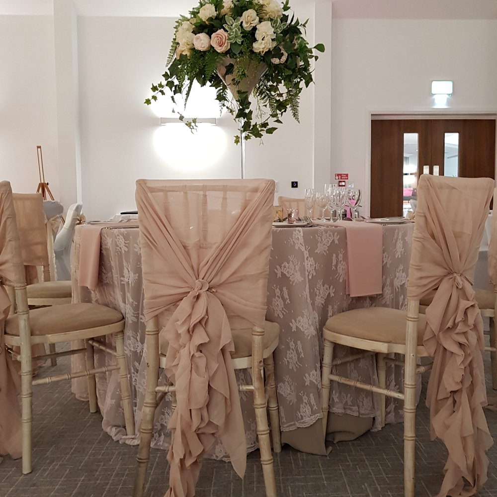 Antique pink chiffon chair drape with ruffle