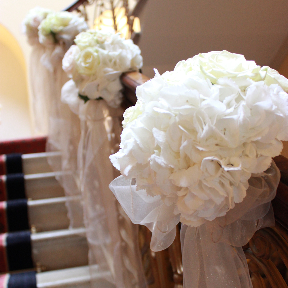 Brocket Hall Main House Stairs with flowers and bows