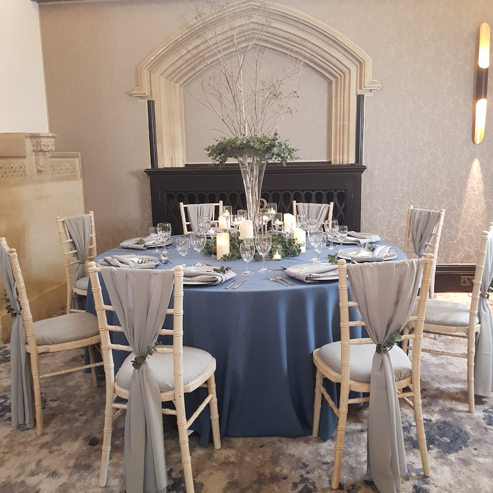 Grey Chiffon Chair drape with airforce dusty blue tablecloth at hanbury manor