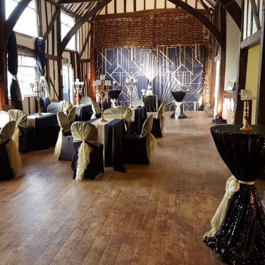 Black Sequin Poseur Table with Gold Bow at Gatsby Party