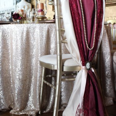 Champagne & Burgundy trip;e wrap hood with pearls and cameo brooch
