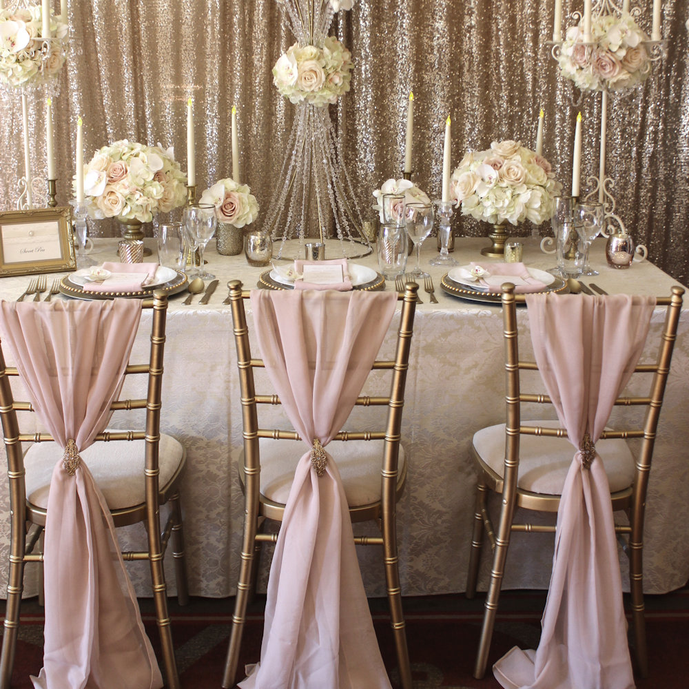 Pale Pink Chiffon chair drapes on gold chiavari chairs