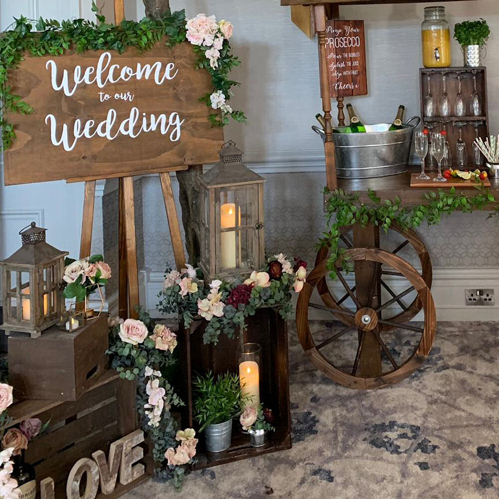 Welcome to wedding sign rustic prosecco cart lanterns foliage green tree cake barrel hanbury manor crate love (10)