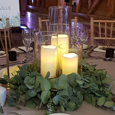 Eucalyprus rings fresh with led candles in cylinder vases