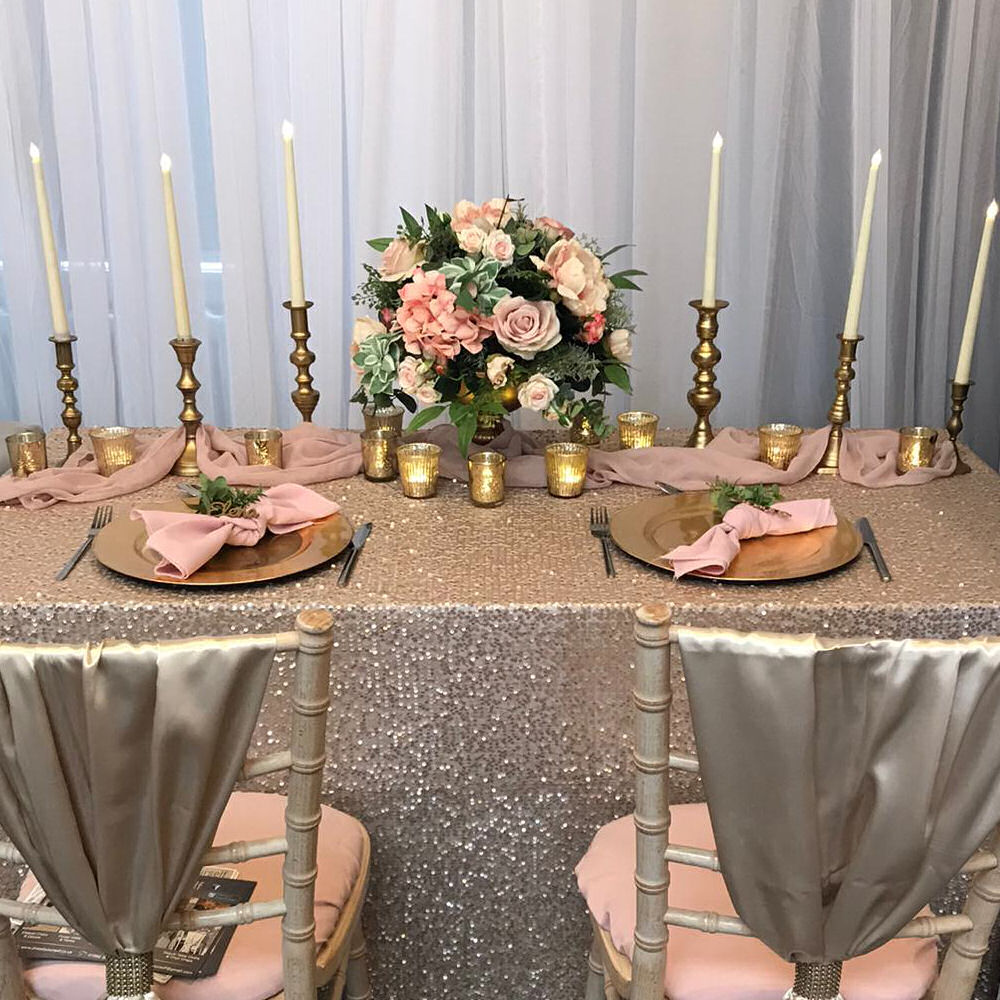 Champagne gold sequin cloth gold charger plate candlesticks blush silk flowers chiffon runner