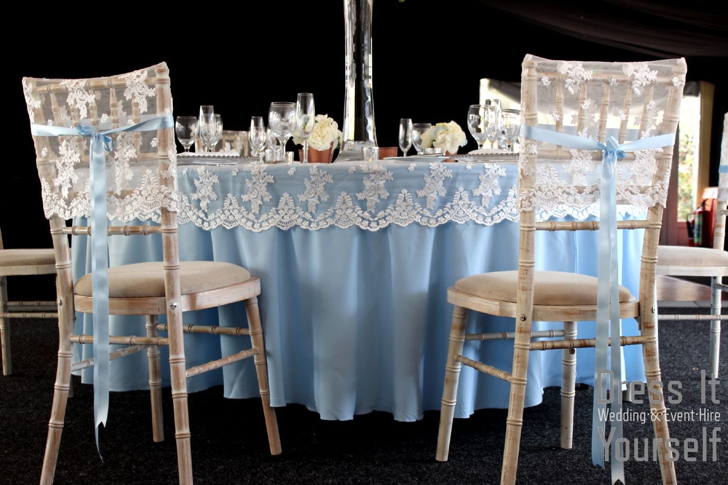 Lace chair cap with blue ribbon