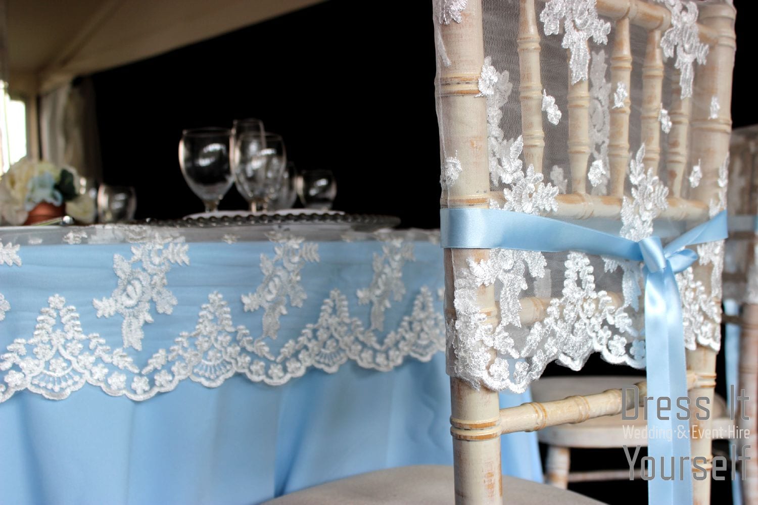 Lace chair cap with blue ribbon