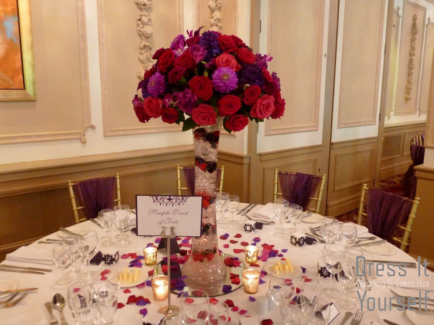 Wide Lily Vase with Purple, Red & Cerise Flowers & Fruit Layers