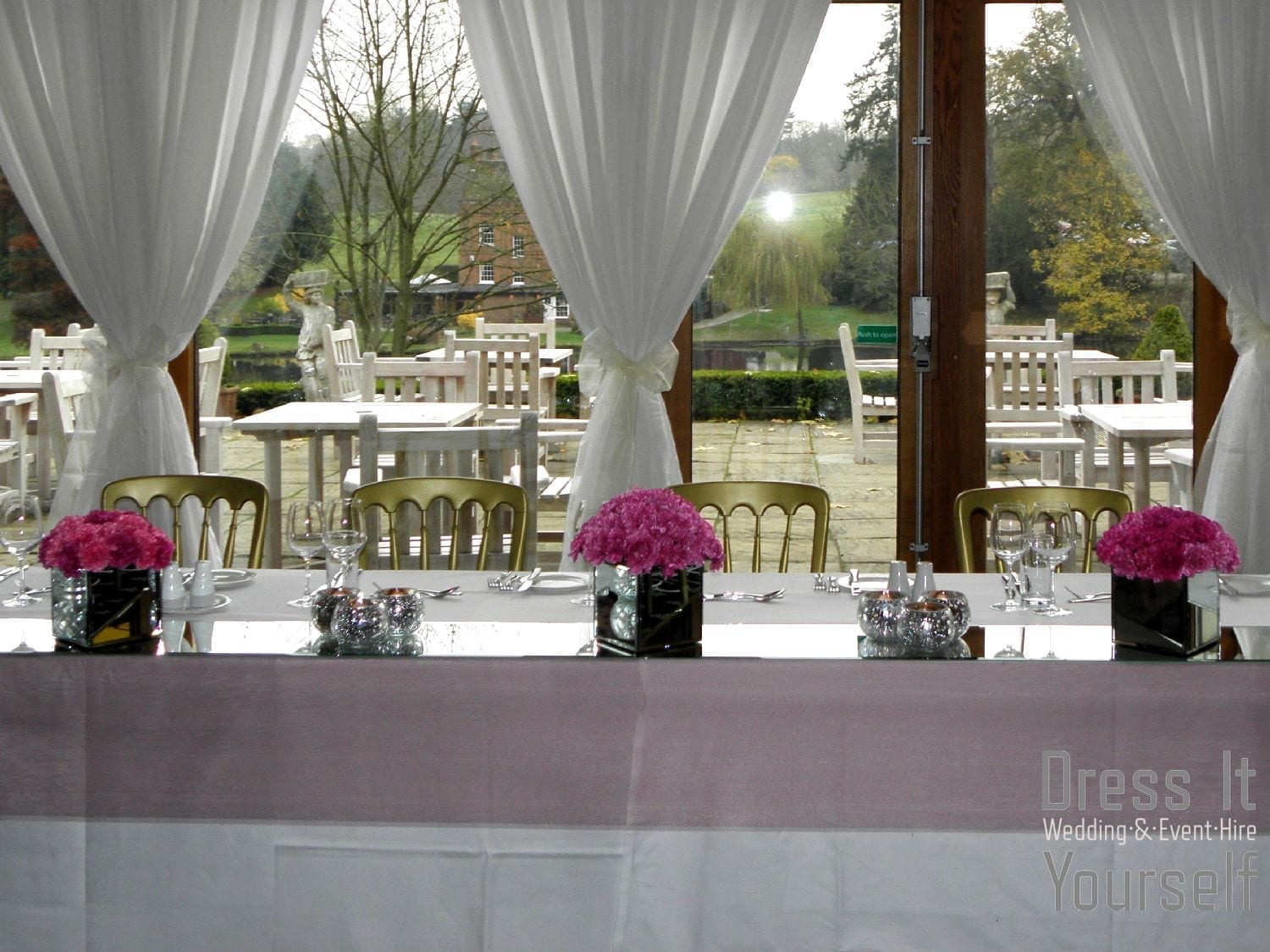 Mirror Cube Vase Hire with Cerise Carnations
