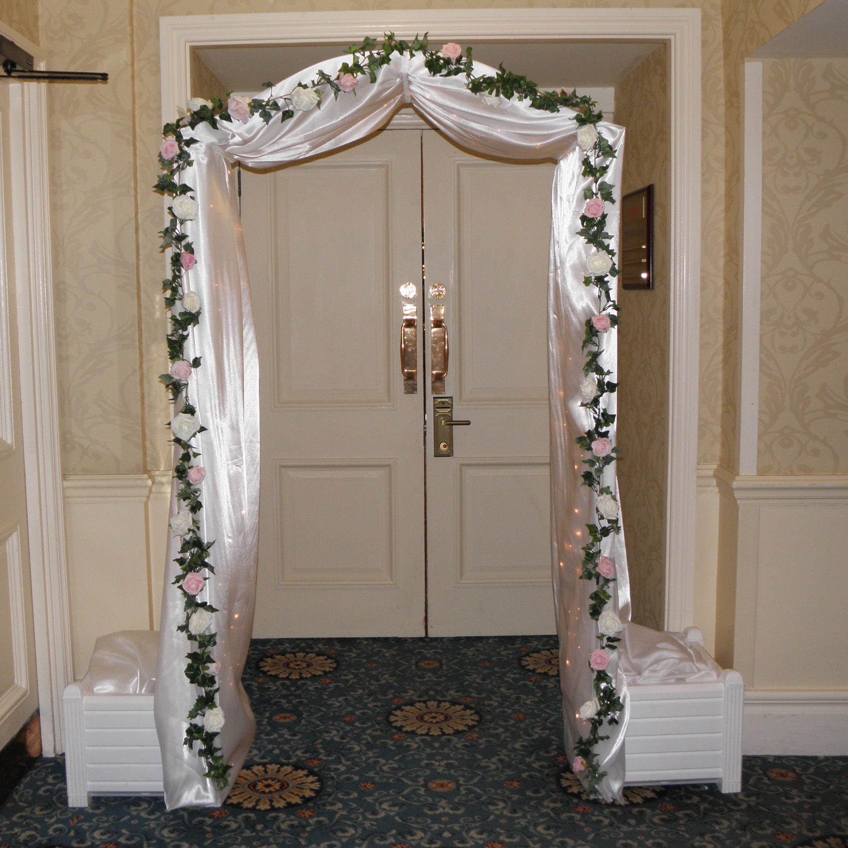 White Arch with Fairy Lights & Flowers Hire - Image 2