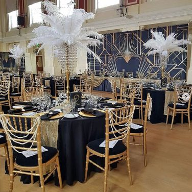 Gatsby Art Deco Black and Gold 1920's Backdrop Gold Chiavari Chairs with Pearl Swags