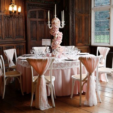 lace cap with blush pink tablecloth