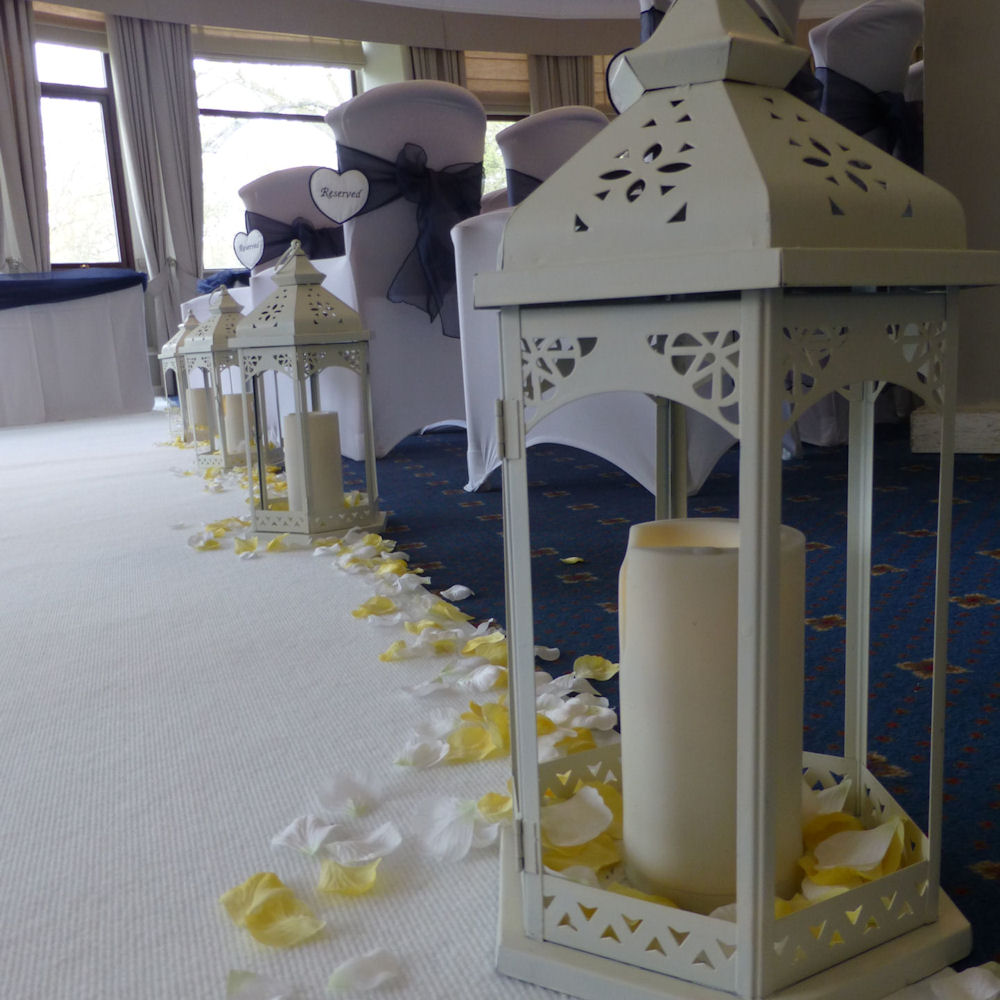 Ivory Vintage Lantern with LED Pillar Candles & Petals down aisle 1