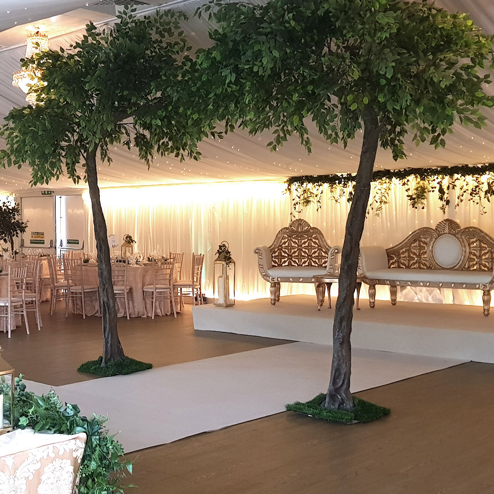 Arch floor standing tree gold sofas stage