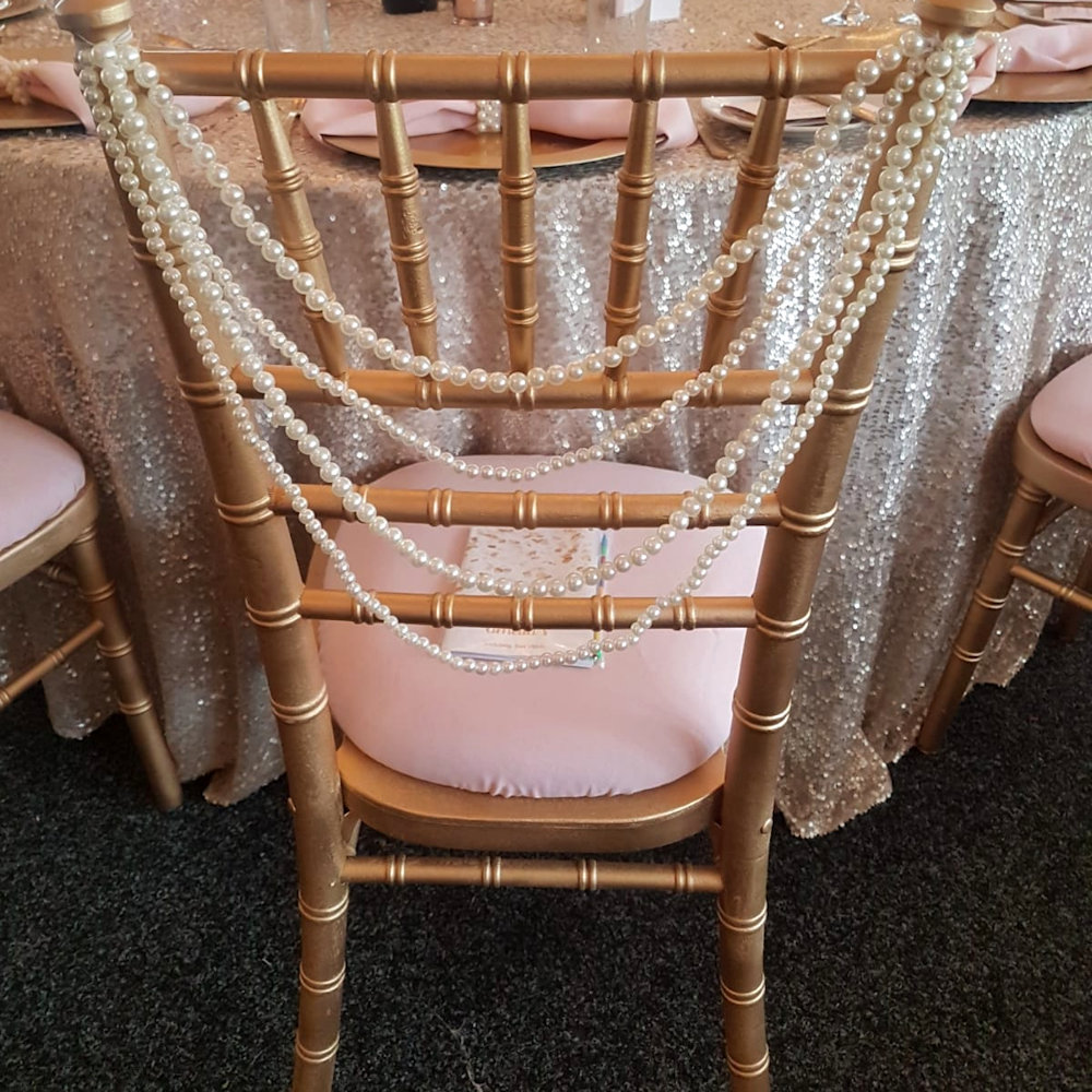 Gold chiavari chair pearls swag & blush seat pad at Hunton park