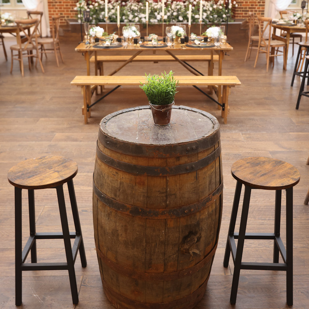 Rustic Oak Benches with Trestle Tables, Whiskey Barrels and Insustrial Stools