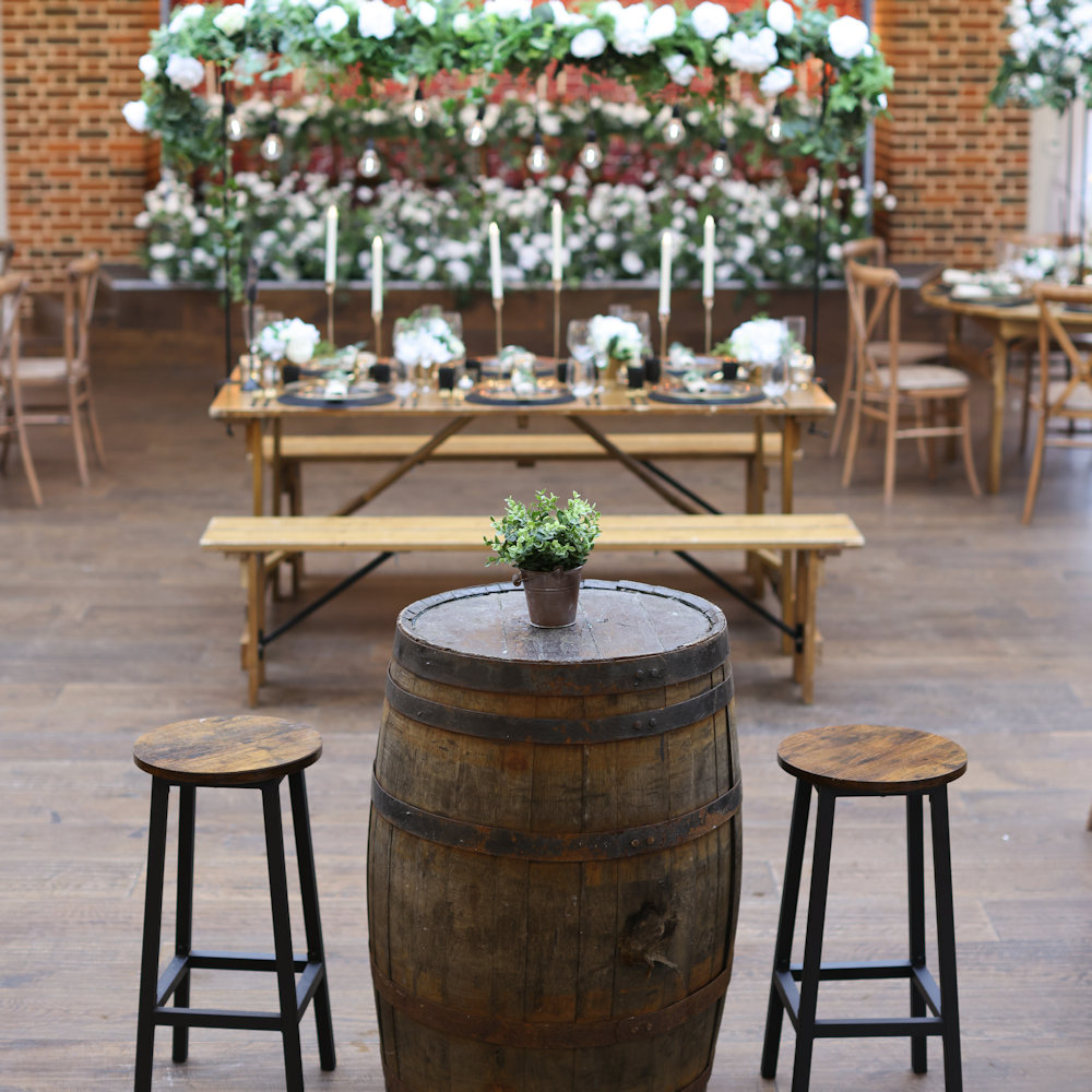 Rustic Oak Benches with Trestle Tables, Whiskey Barrels and Insustrial Stools