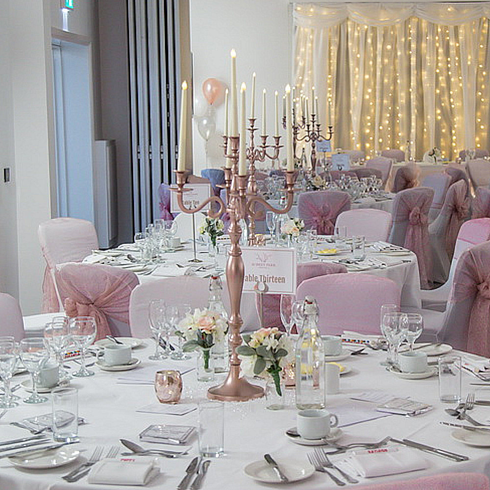 Dusky Pink rose gold candleabras chair covers white fairy light backdrop aubrey park (2)