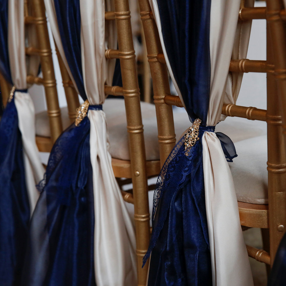 Gold Chiavari Chairs with Champagne & Navy Wraps