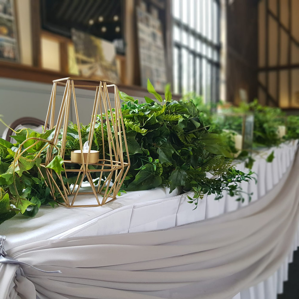 Geometric Candle Holders on Top Table with Eucalyptus Garland