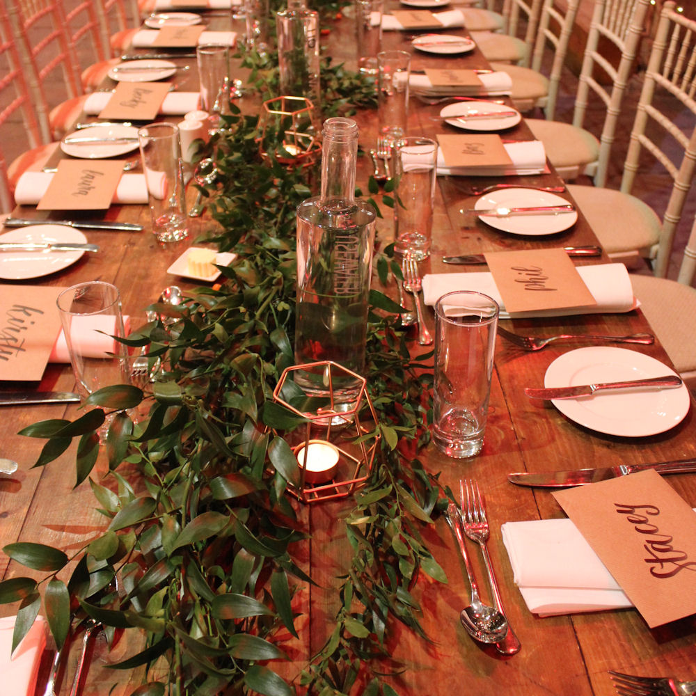Geometric Candle Holders on Top Table with Eucalyptus Garland