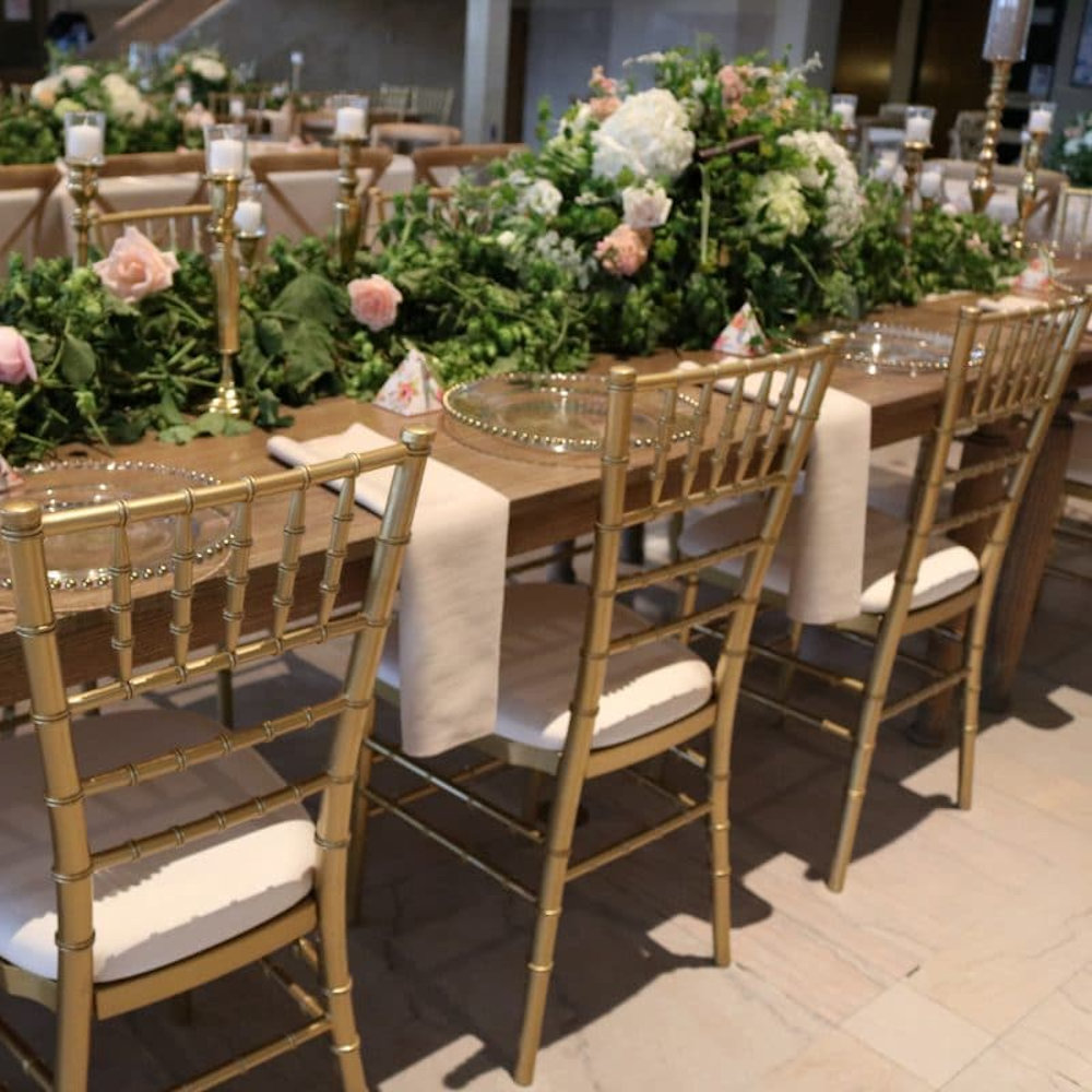 Oak rustic tables gold chiavari chairs vendella napkins charger plates