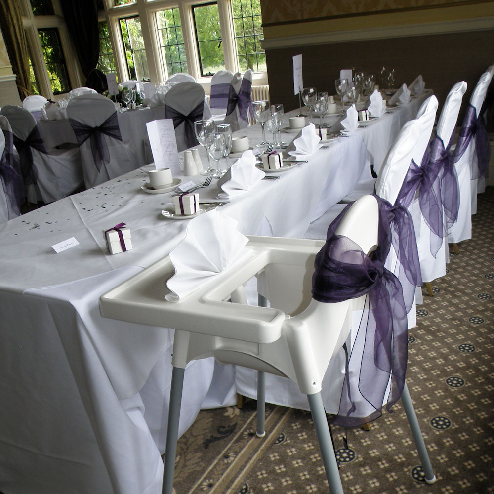 White High Chair with Dark Purple Bow