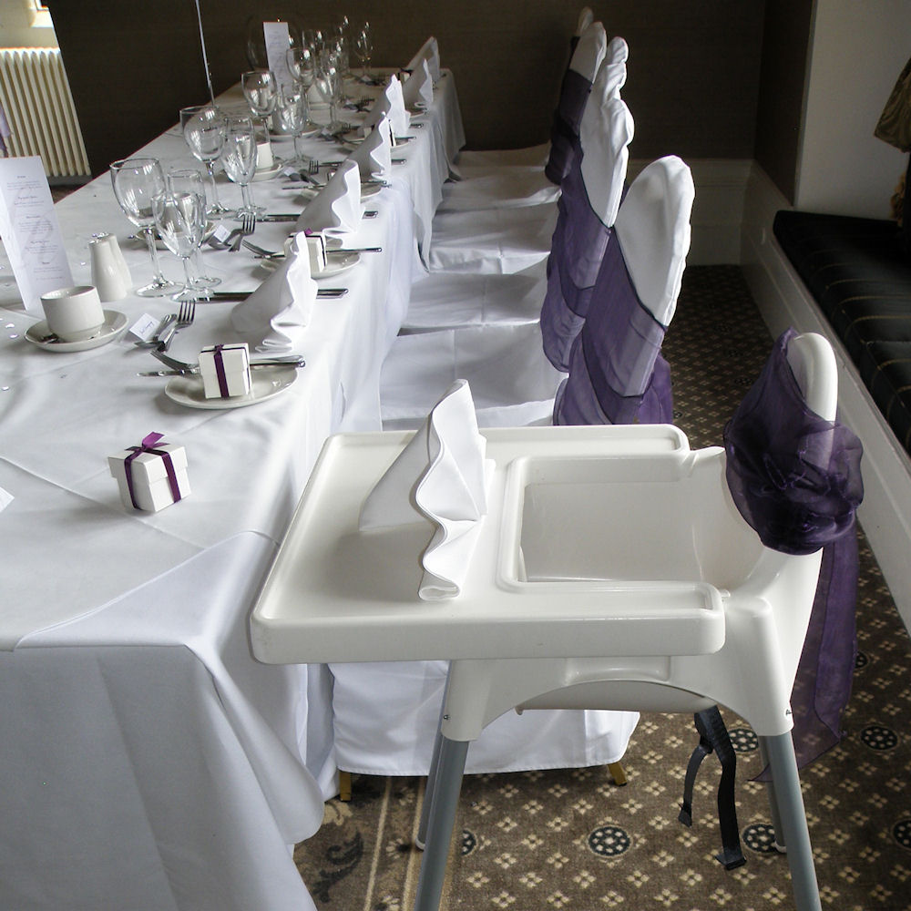 White High Chair with Dark Purple Bow