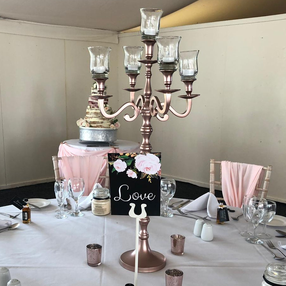 Rose Gold candleabra with hurricane tea light holders at hunton park