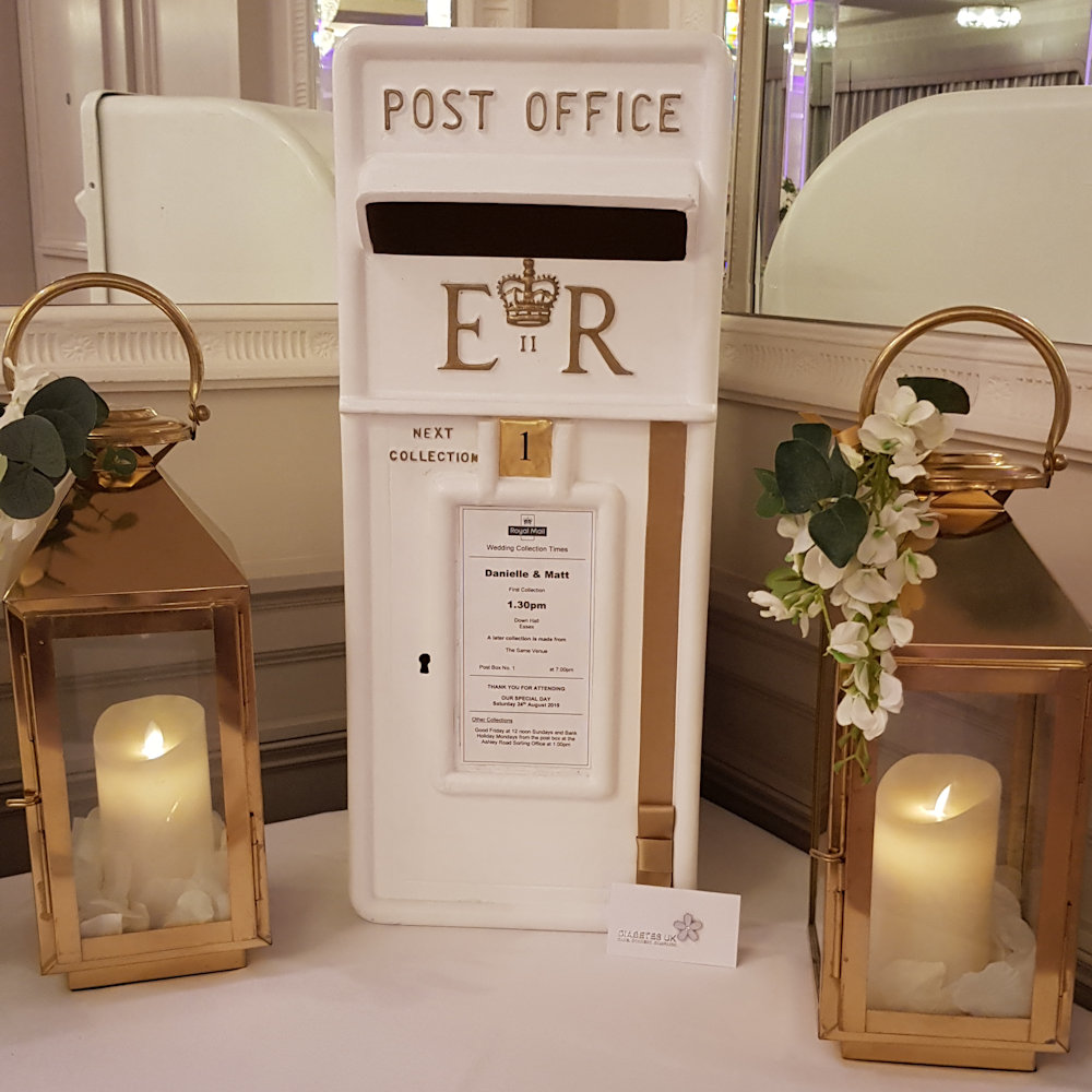 Royal mail post box with gold lanterns & wisteria