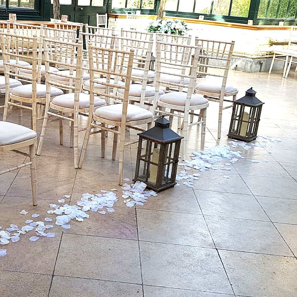 Rustic Wooden Lantern at Wedding Ceremony with Petals