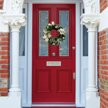 Silver wreath on red front door