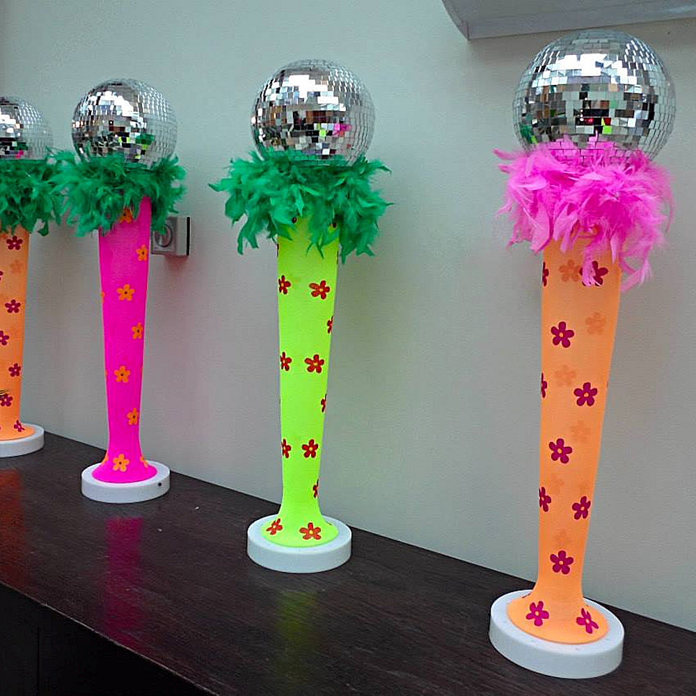 60's Style centrepieces with mirror ball and feathers on top