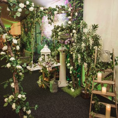 Branch Stick Arch with rose garland and swing