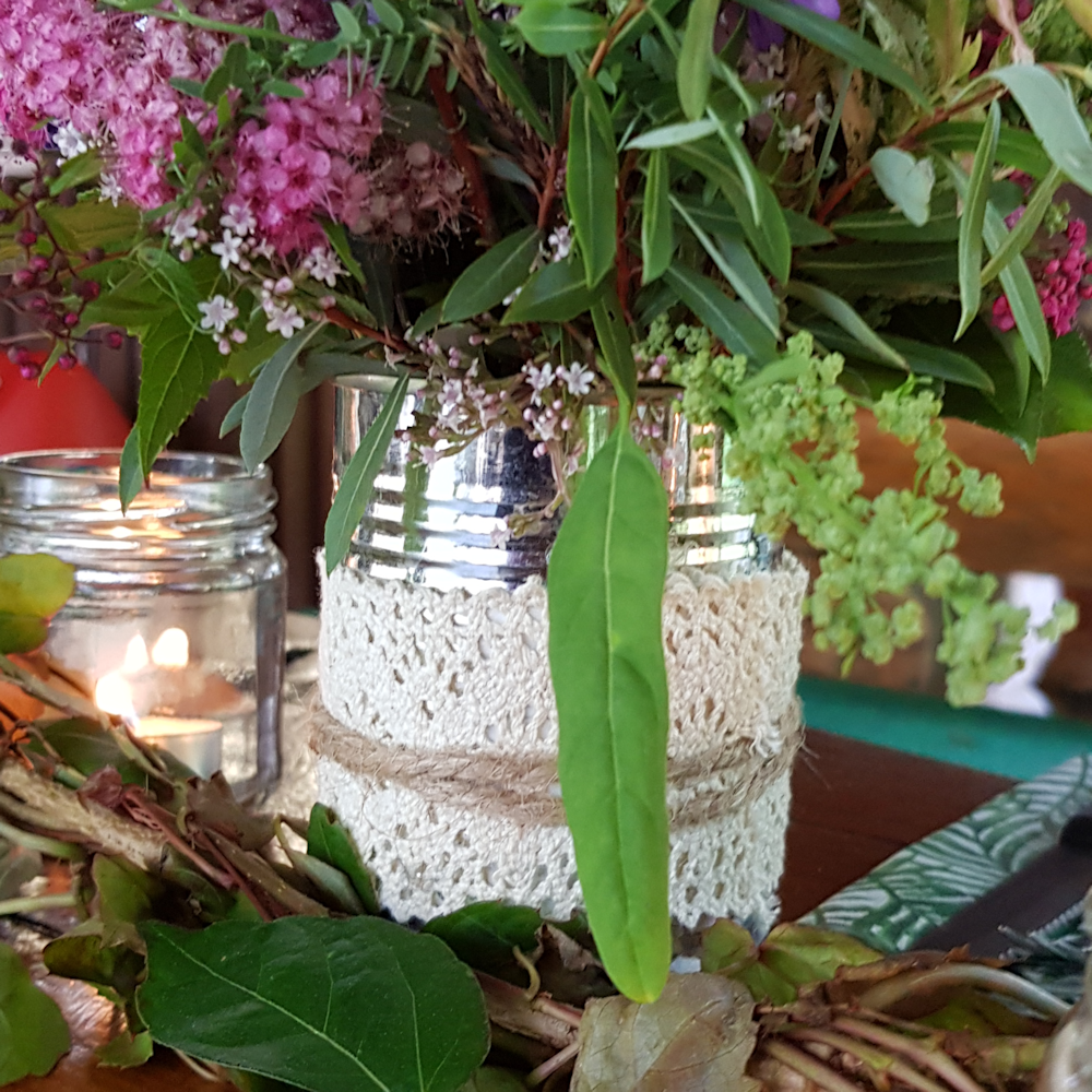 Tins with lace and String wild flowers long table