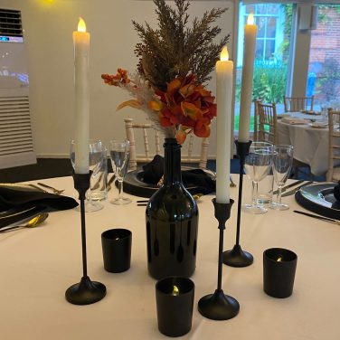 Black candlestick with LED candles and black tea light holders votives