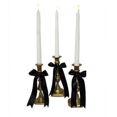 Brass Candlesticks with Black bows and LED candles to hire gatsby