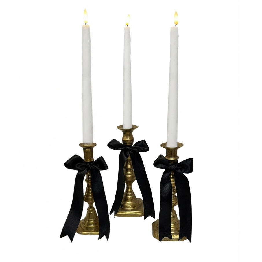 Brass Candlesticks with Black bows and LED candles to hire gatsby